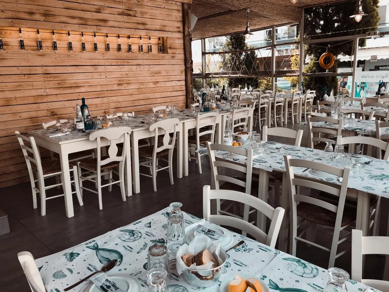 Our taverna dining room, with the white tables laid